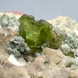 775 Carat Green Sphene Crystals Specimen With Fluorescent Calcite From Gilgit Pakistan